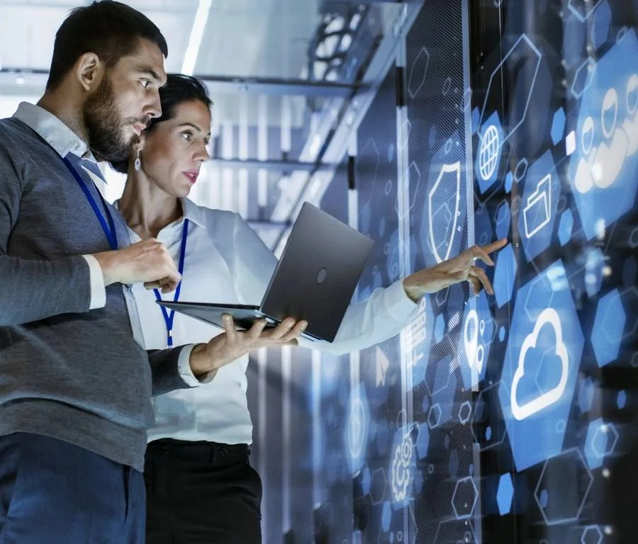 IT consultants working with a digital security and cloud interface